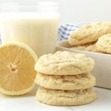 A stack of three vegan lemon cookies on a table.