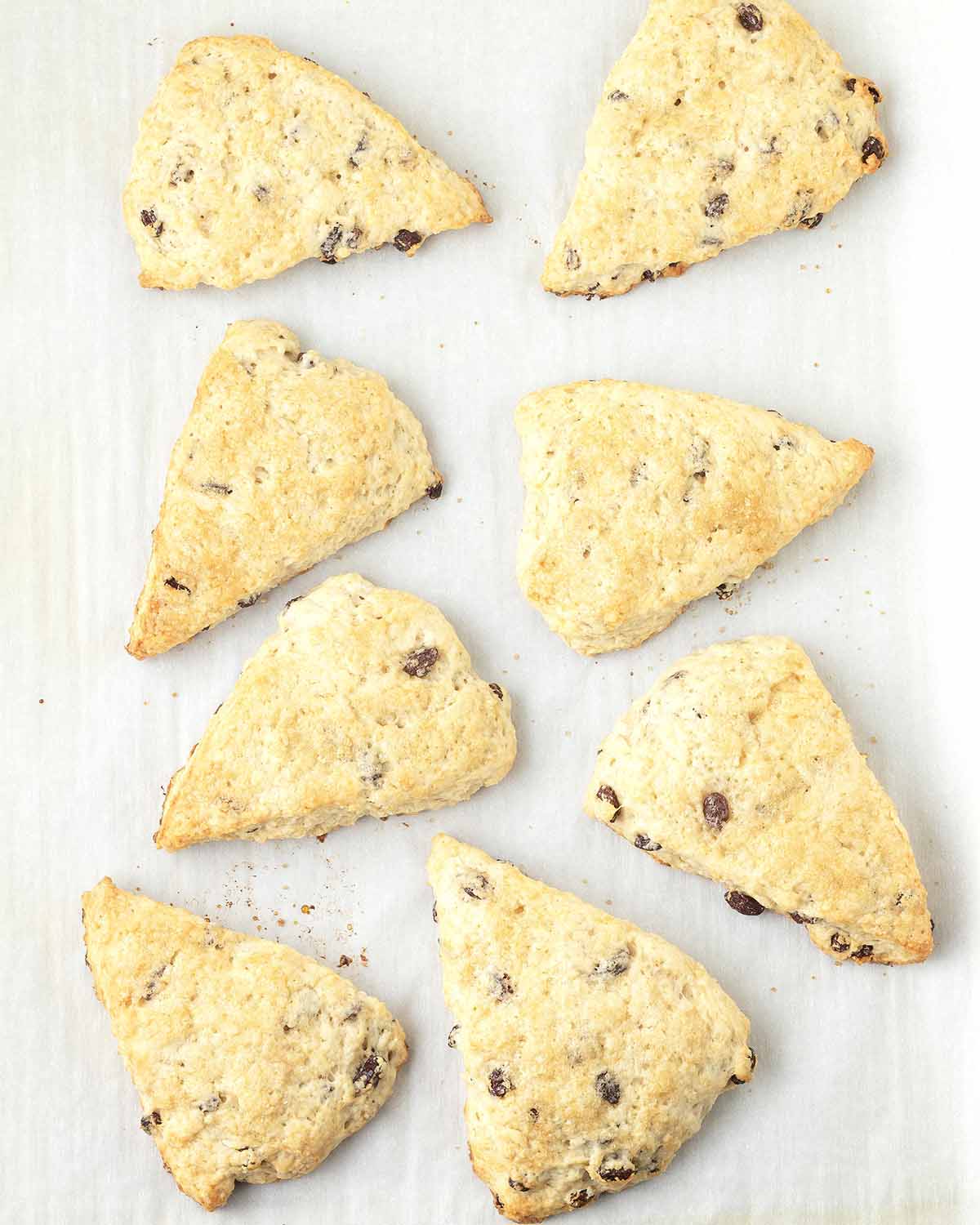 Freshly baked vegan scones on a baking sheet.