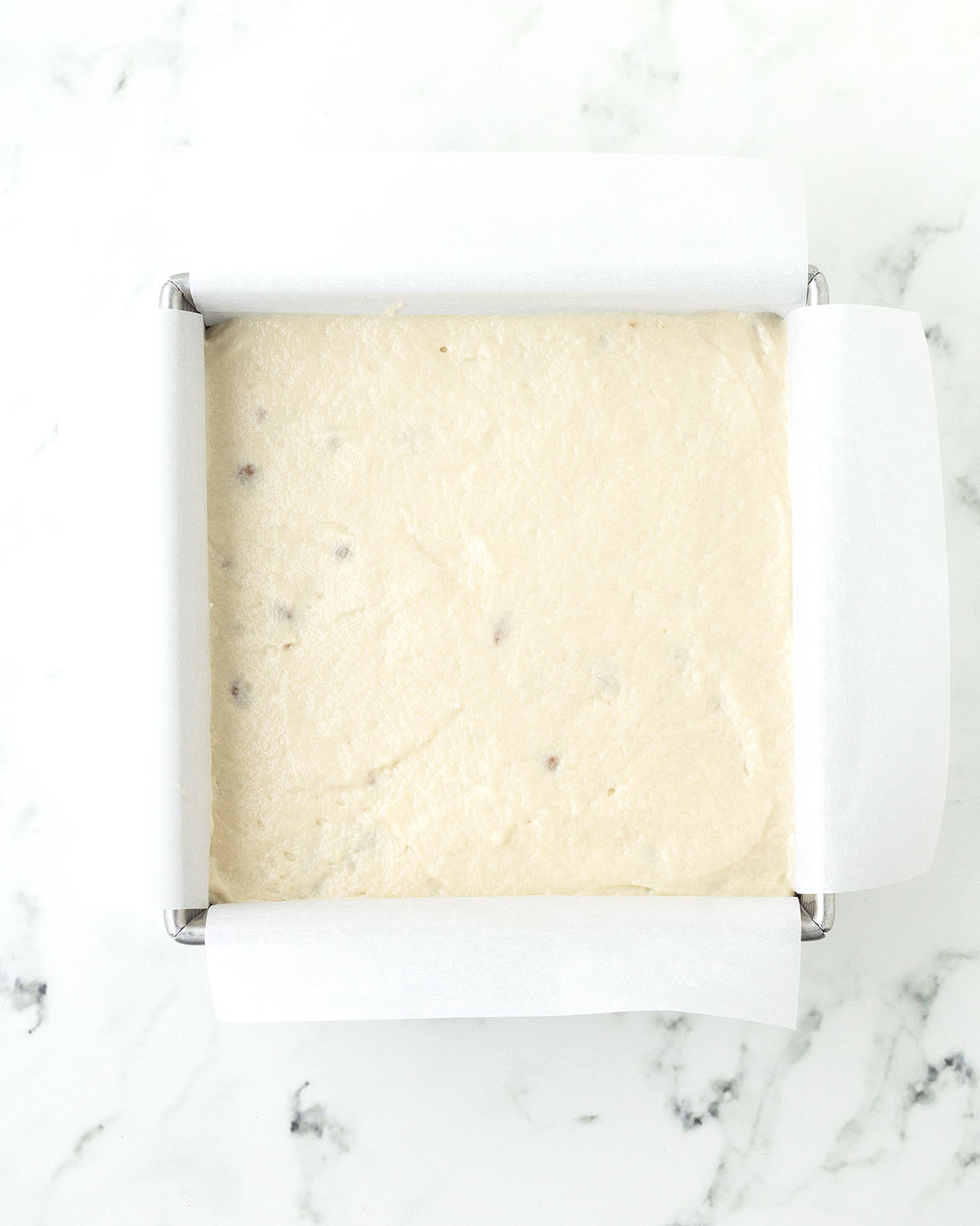 Coffee cake batter in a baking pan.