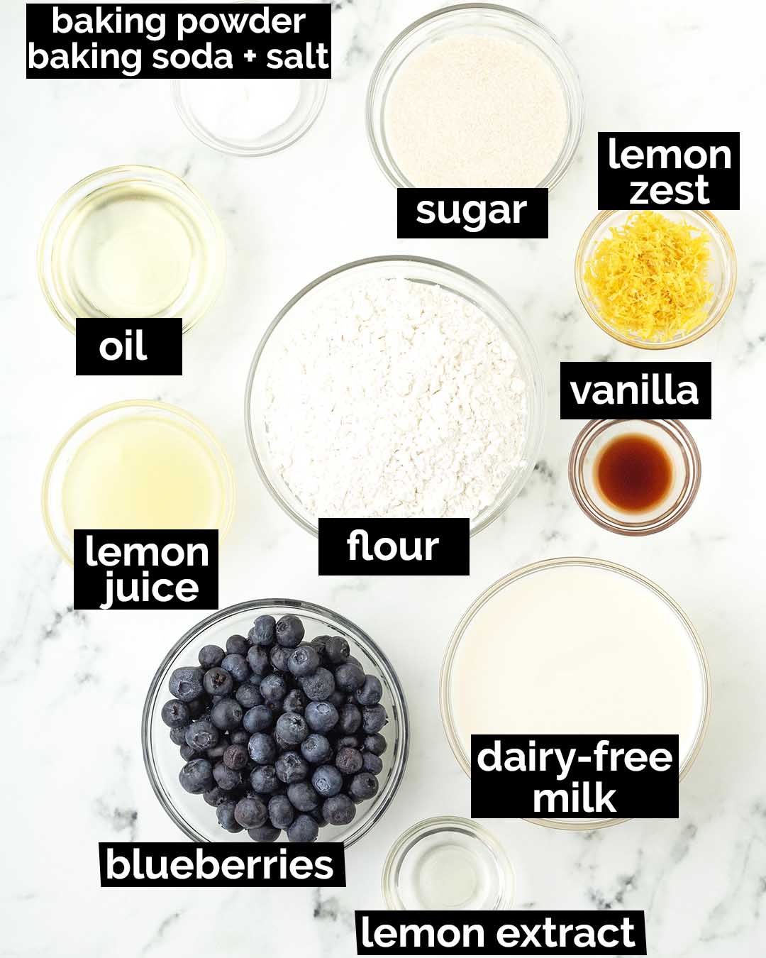 An overhead image showing the ingredients needed to make vegan lemon blueberry muffins.