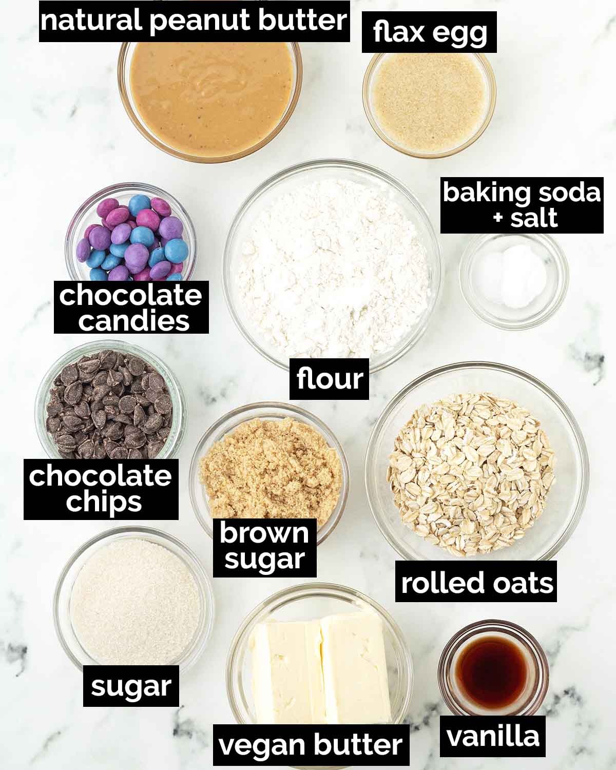 An overhead shot showing the ingredients needed to make vegan monster cookies.