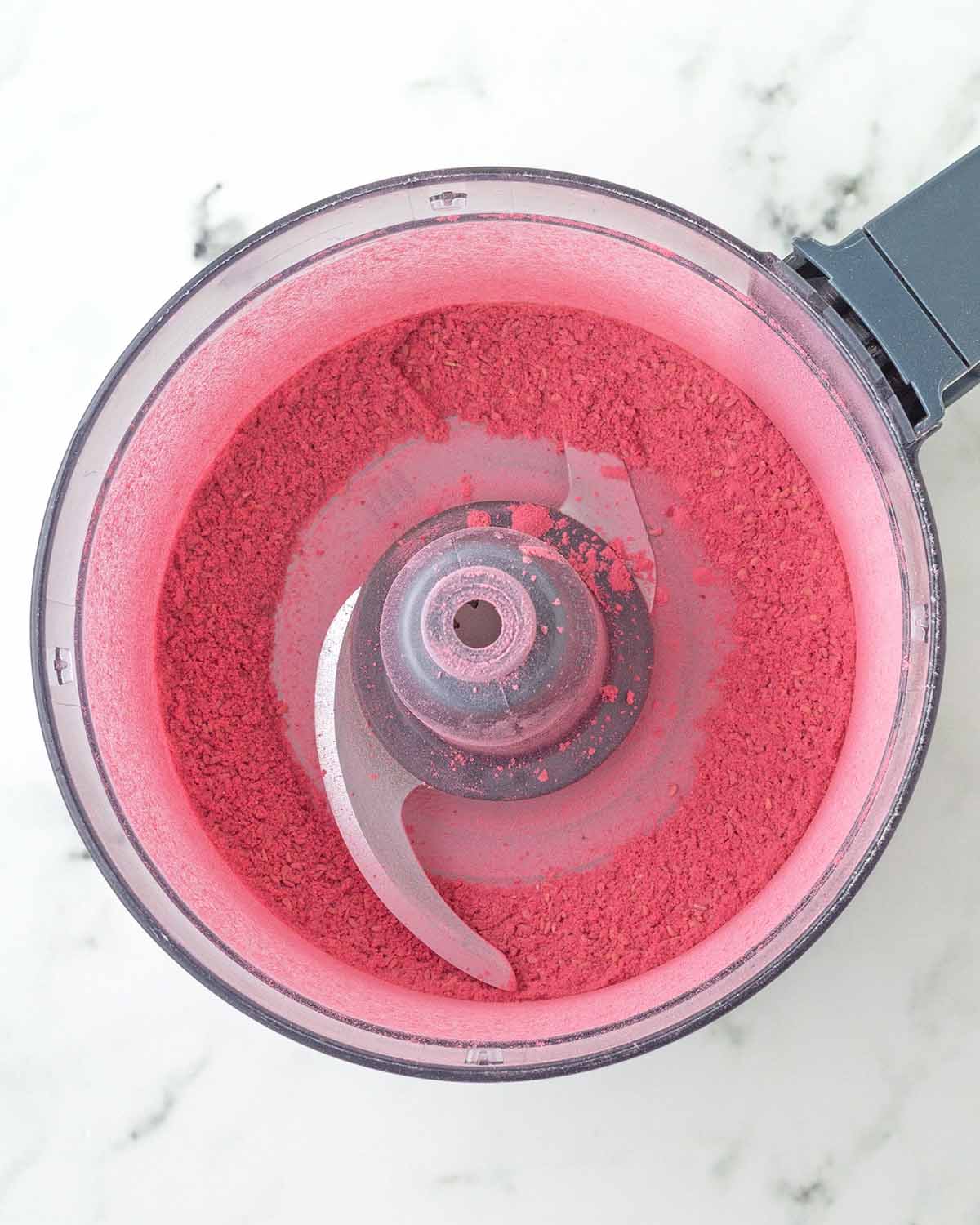 Freeze-dried raspberry powder in a food processor.