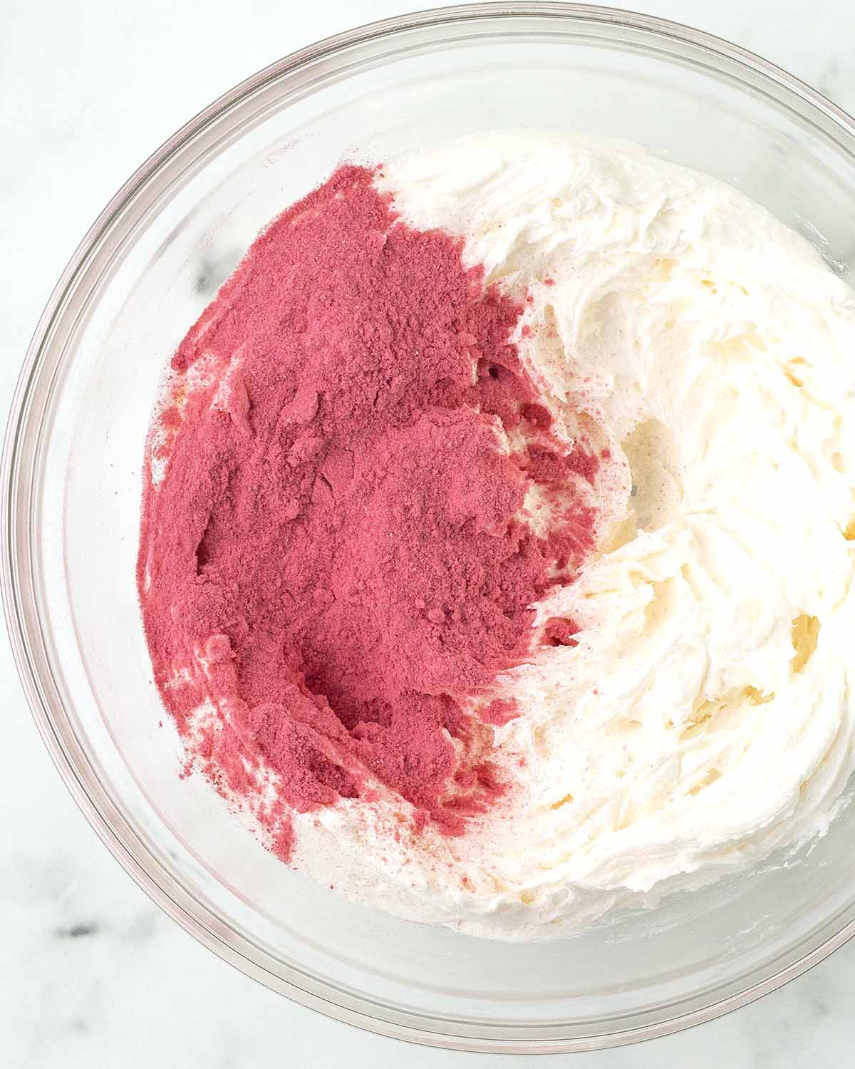 Freeze-dried raspberry powder on top of frosting.