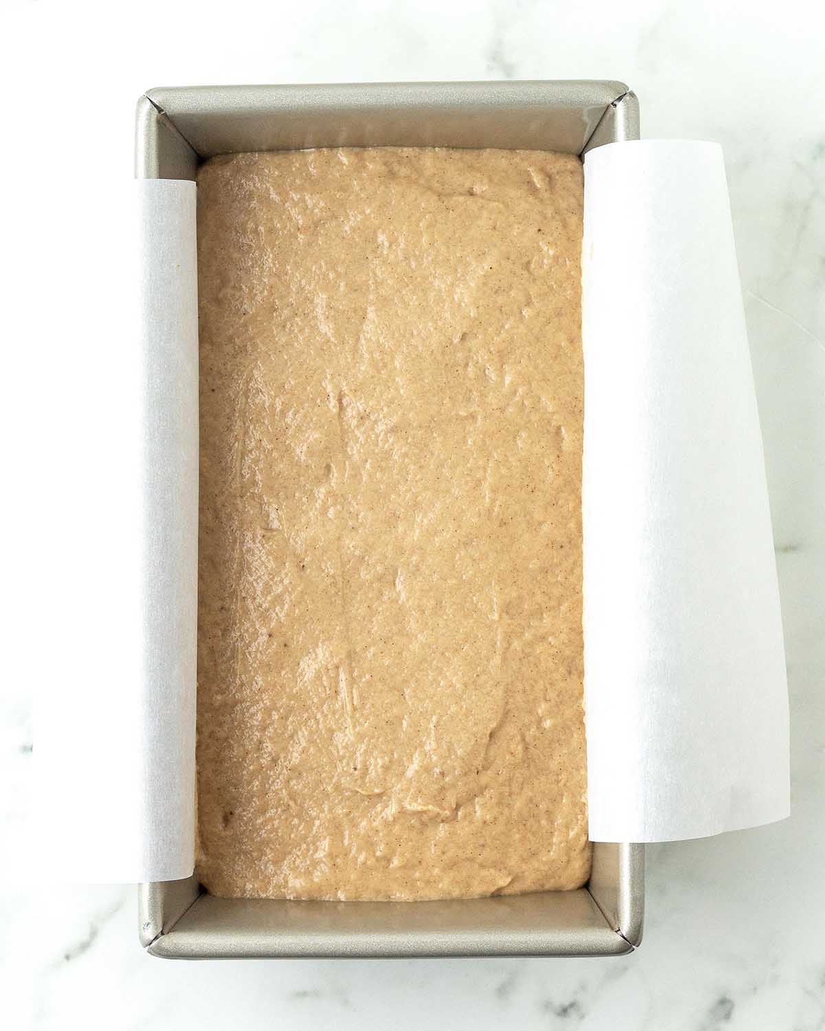 Banana bread batter in a loaf pan just before baking.
