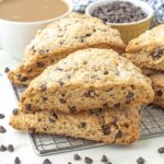 Vegan chocolate chip scones on a metal rack.