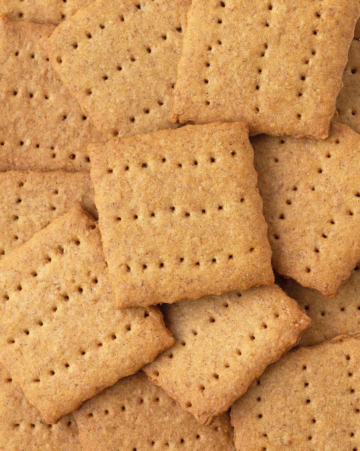 An overhead close up image of several graham crackers on a rack.