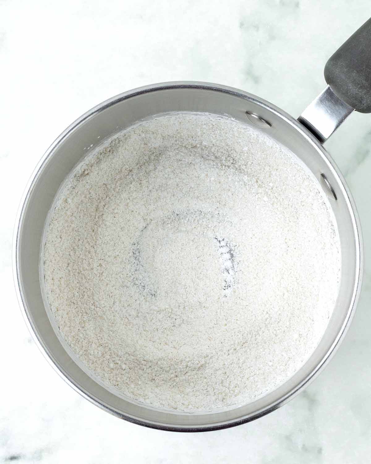 Dry custard ingredients in a pot.