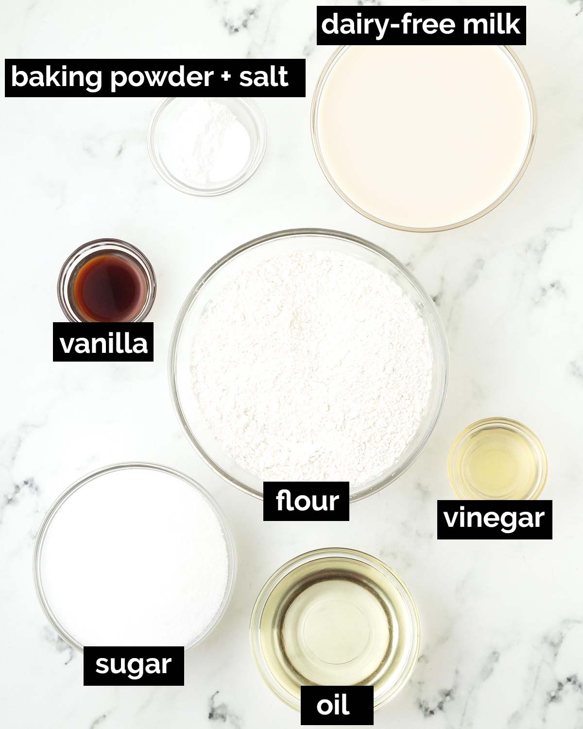 An overhead shot showing the ingredients needed to make vegan vanilla sheet cake.