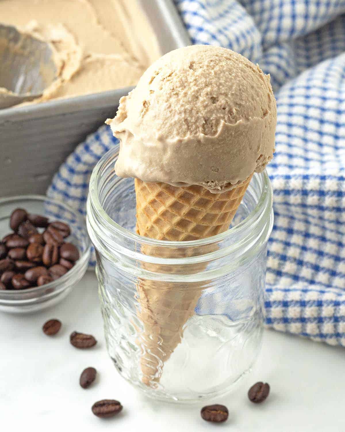 A coffee ice cream cone in a glass mason jar.